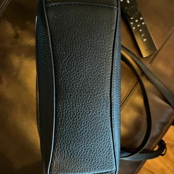 This is a NWT Kate Spade purse in black pebble leather with gold furnishings. - Picture 5 of 9